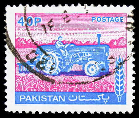 MOSCOW, RUSSIA - FEBRUARY 21, 2019: A stamp printed in Pakistan shows Tractor, Agriculture serie, circa 1978のeditorial素材
