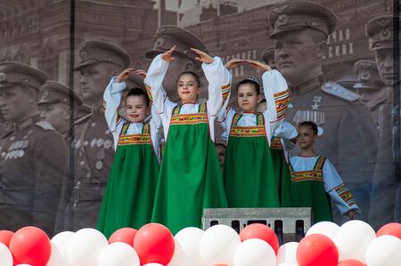 MOSCOW, RUSSIA - MAY 9, 2019: Unidentified girl collective dance on a scene during event dedicated to Victory Day on May 9, 2019のeditorial素材
