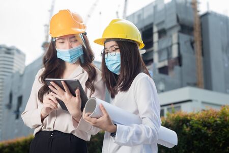 Group of diversity people engineer wearing face mask or surgical mask when meeting or discussing...