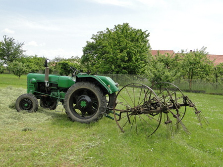 Drying of hay with tractorの写真素材