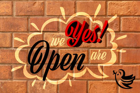 Yes We Are Open Speech Bubble Sign On Brick Wallの写真素材