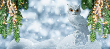 Christmas White Winter Decoration With Owl On Snow And Fir Tree Branches With Lightsの写真素材