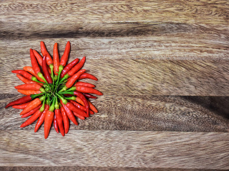 Chili on the cutting wood board.の写真素材