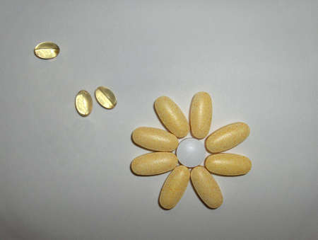 Assorted pills arranged as a flowerの写真素材