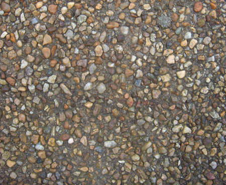Small stones embedded in a walkway suitable for background or wallpaperの写真素材