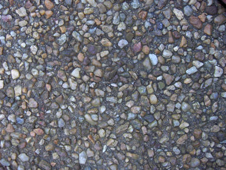 Small stones embedded in a walkway suitable for background or wallpaperの写真素材