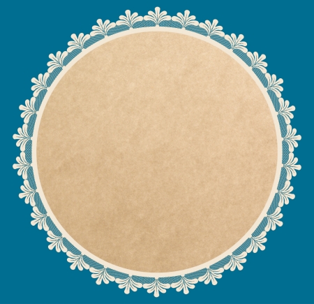 Brown paper round frame with lacy side on blue background  の写真素材