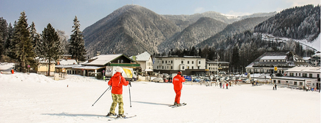 Instructor and student in red colorful ski equipment in alpine ski school. Skiing resort Semmering, Austria, february 2011. Skier learning and exercising skiing.のeditorial素材