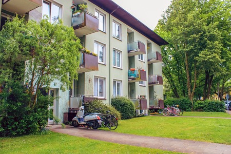 Apartments in townhouses, Altona Germany, june 2010. European apartment building with balconies, a lawn with green grass and bicyclesのeditorial素材