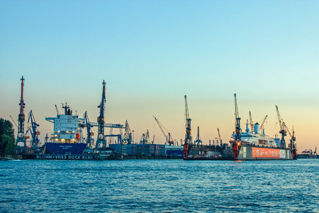 Shipyard and harbor shipbuilding with crane machine and container ship in Hamburg Germany, june 2010のeditorial素材