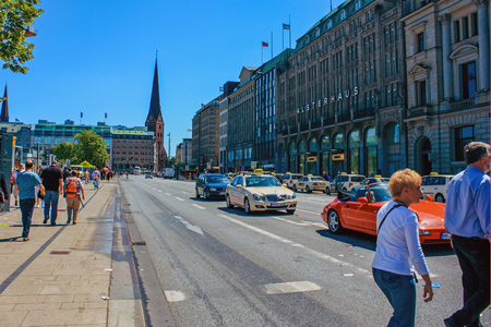 Street with people and cars near metro station Alsterhaus and lake Alster (Binnenalster) Hamburg, Germany. June 2010のeditorial素材