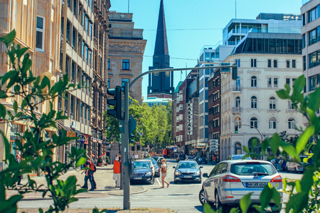 Street with people and cars near metro station Alsterhaus and lake Alster (Binnenalster) Hamburg, Germany. June 2010のeditorial素材