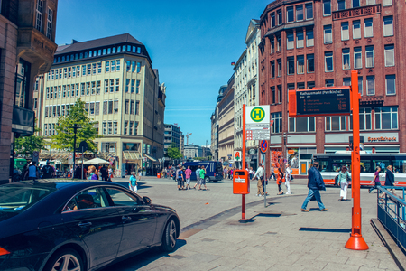 Street with people and cars near metro station Rathausmarkt and town hall Rathauson the market square, near lake Alster Binnenalster in Altstadt quarter, Hamburg, Germany. June 2010のeditorial素材