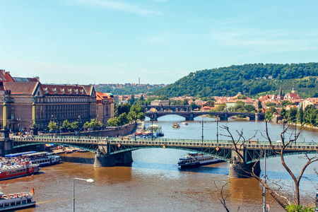 River Vltava with pleasure boats sailing under bridges in Prague, Czech Republic. June 2010のeditorial素材