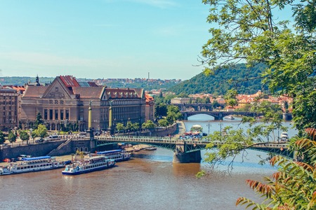 River Vltava with pleasure boats sailing under bridges in Prague, Czech Republic. June 2010のeditorial素材