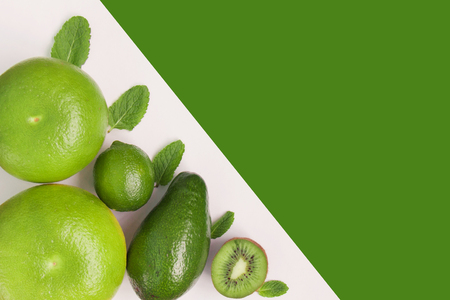 Creative background of green various summer tropical fruits.の写真素材