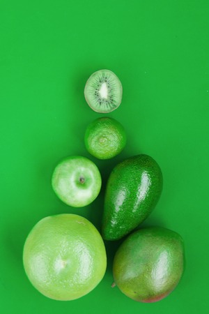 Creative background pyramid green various summer tropical fruits.の写真素材