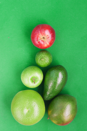 Creative background pyramid green various summer tropical fruits.の写真素材