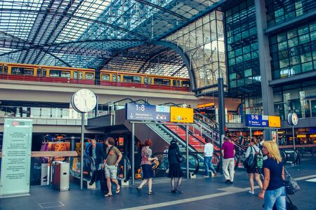 Berlin june 2010. People in central main railway train station in Berlin, Germany. The historic Lehrter Bahnhof is opened in 2006.のeditorial素材