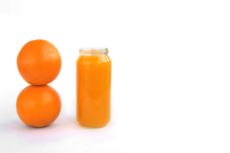 Creative background two orange juice isolated on white paper.の写真素材