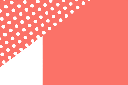 Beautiful background of paper of color living coral polka dot and white with copy space for text. Top view, close up. Card concept.の写真素材