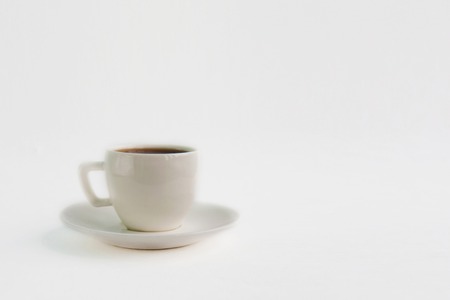 White espresso coffee cup saucer on paper background, front view copy space close upの写真素材
