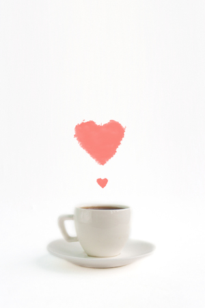 White espresso coffee cup saucer with heart shaped steam on paper background, front view copy space close upの写真素材