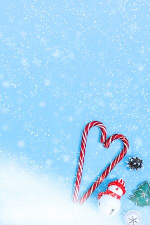 Christmas and New Year pastel background with decorations and sweets. Copy space for text, greeting lettering. Flat lay, top view.の写真素材