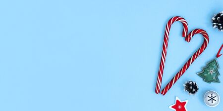 Christmas and New Year pastel background with decorations and sweets. Copy space for text, greeting...