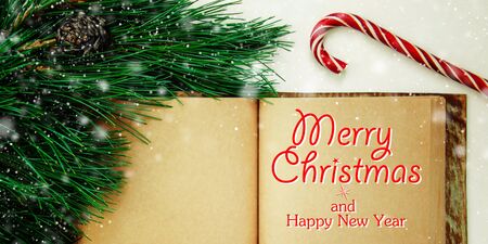 Christmas and New Year decorative background with decorations and sweets. Template, greeting lettering. Flat lay, top view. Web bannerの写真素材