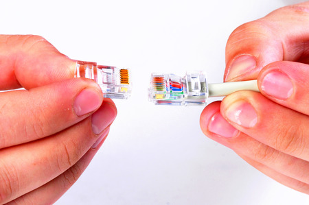 two internet cables holding on hand.Stages Of The Process