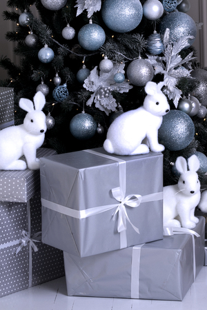 ornaments christmas tree. gifts under the tree. bunny figuresの写真素材