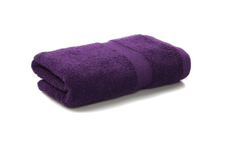 Violet towel folded isolated on white backgroundの写真素材