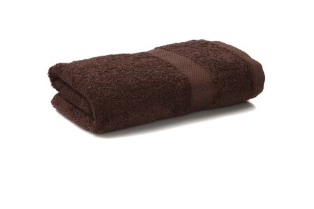brown towel rolled isolated on white backgroundの写真素材