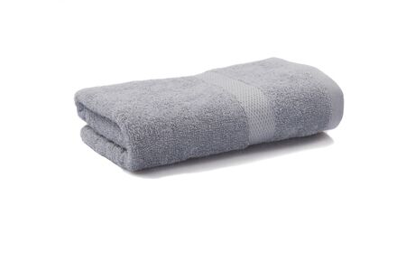 light gray towel rolled isolated on white backgroundの写真素材