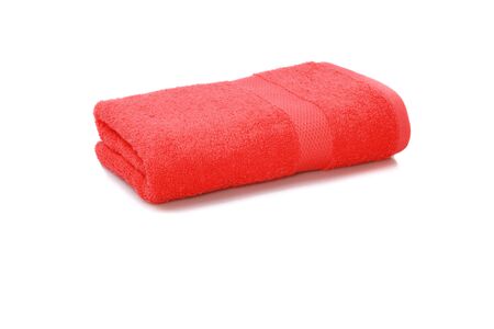 red towel folded isolated on white backgroundの写真素材