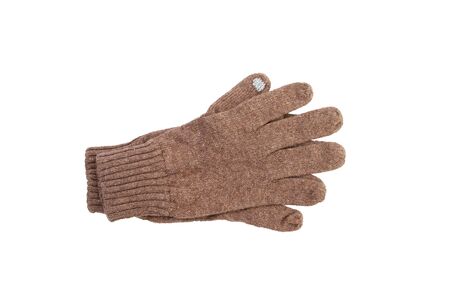 beige knitted gloves isolated on white. gloves with a sensitive finger to the phone sensorの写真素材