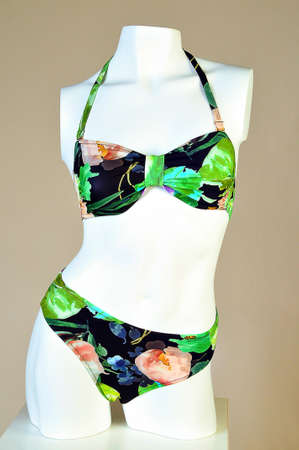 Mannequin with female swimsuit isolated. women's swimsuit with floral patternsの写真素材