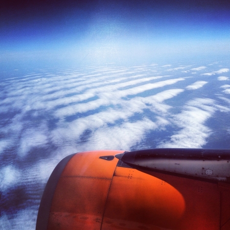 Above the clouds scenic view from planeの素材