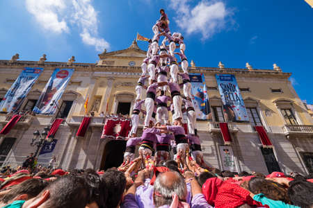 Tarragona, Spain - September 23, 2018: Castells performance during Santa Tecla's Festival by Colla Jove de Tarragona. A castell is a human tower built traditionally in festivals in Catalonia.のeditorial素材