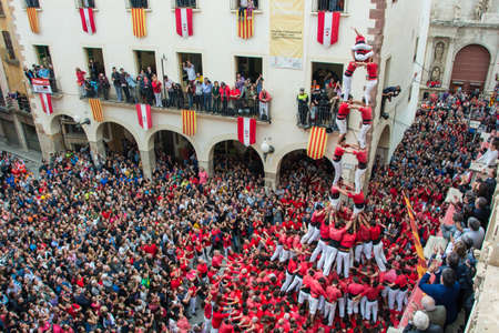 Valls, Spain - October 25, 2015: Castells performance during Santa Ursula's Festival by Colla Joves de Valls. A castell is a human tower built traditionally in festivals in Catalonia.のeditorial素材