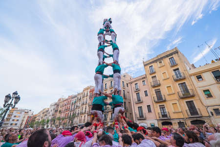 Tarragona, Spain - June 24, 2019: Castells performance during Sant Joan's Festival by Castellers de Sant Pere i Sant Pau. A castell is a human tower built traditionally in Catalonia.のeditorial素材