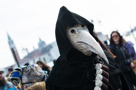 Venice, Italy - February 16, 2020: An unidentified person in a carnival costume in Piazza San Marco attends at the Carnival of Venice.のeditorial素材