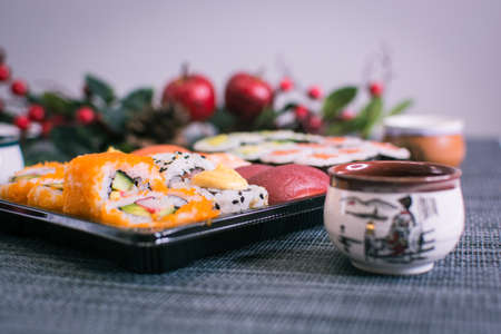 Sushi nigiri and maki set with Christmas or New Year concept background. Traditional japanese food.の写真素材