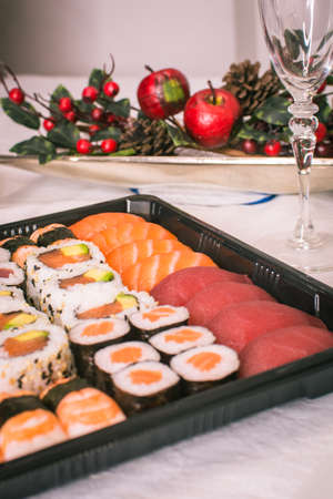 Sushi nigiri and maki set with Christmas or New Year concept background. Traditional japanese food.の写真素材
