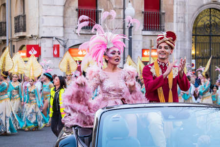 Tarragona, Spain - February 19, 2020: Participants in colorful and bright costumes take part in a carnival parade in Tarragona, one of the best carnivals in Spain.のeditorial素材