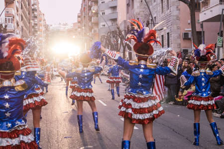 Tarragona, Spain - February 19, 2020: Participants in colorful and bright costumes take part in a carnival parade in Tarragona, one of the best carnivals in Spain.のeditorial素材
