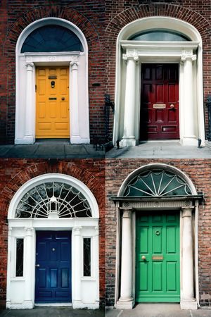 A composite of four traditional Edwardian brightly painted doors in a residential area of the city of Dublin in Irelandの写真素材
