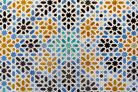 Moorish glazed tiles mosaic pattern in the Alcazar palace of Seville, Spainの写真素材