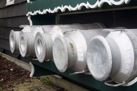 a row of dutch milkcansの写真素材